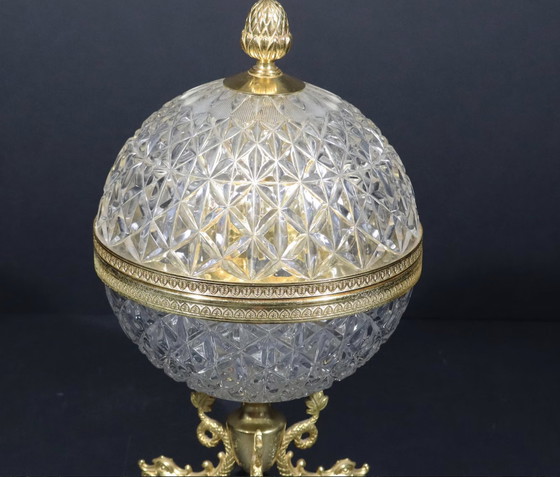 Image 1 of Moulded And Cut Crystal Liqueur Or Vodka Cellar Shaped With A Sphere Mounted On A Base Decorated With 3 Gilded Brass Dolphins