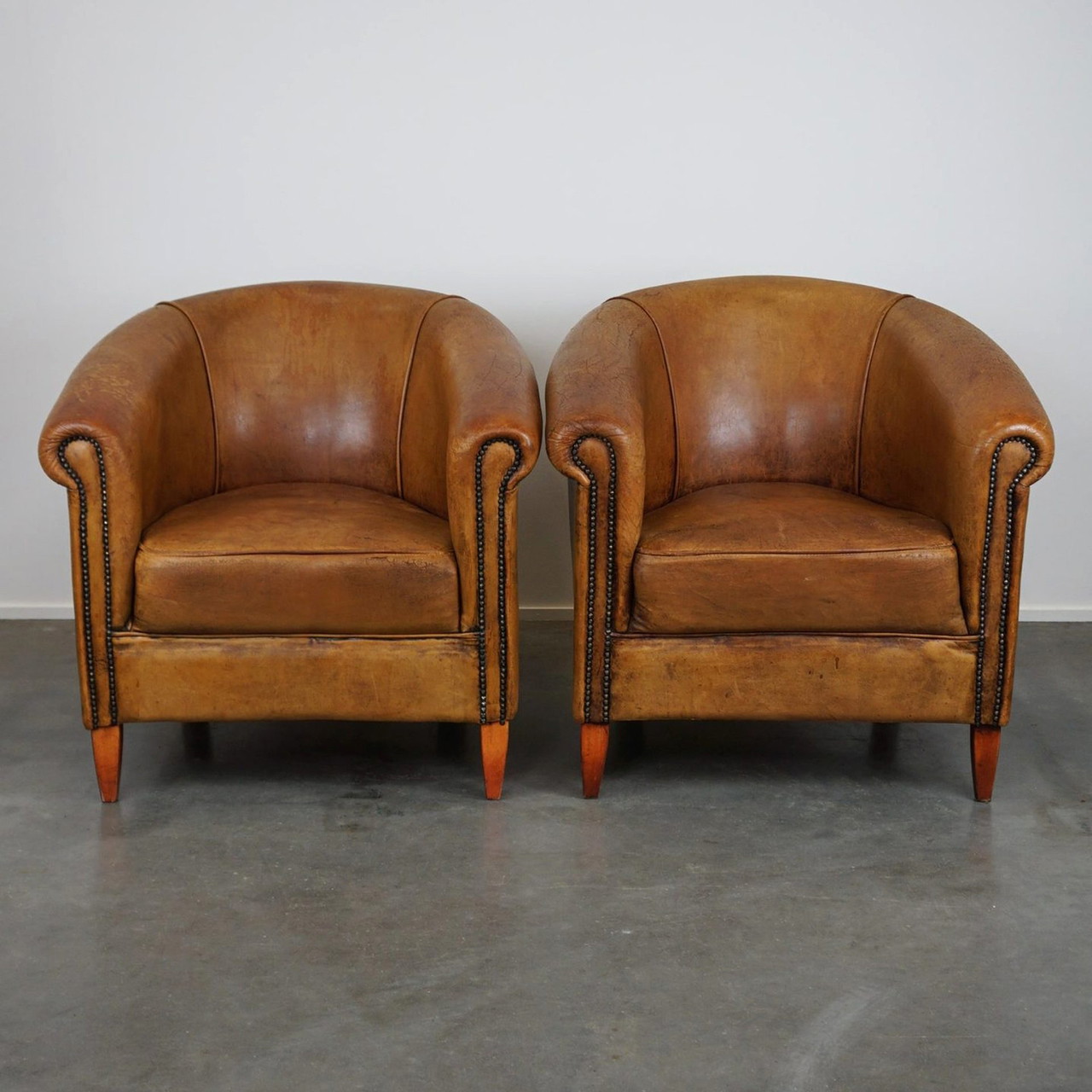 2 x sheep leather club chairs with a vintage look