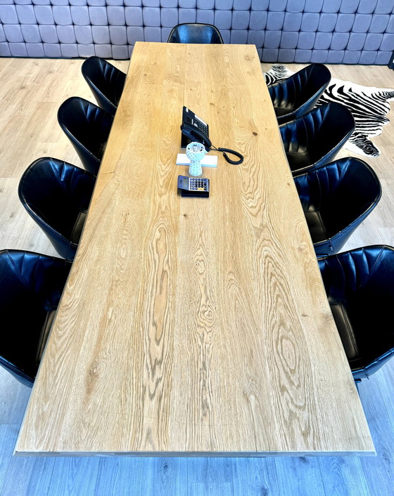 Image 1 of Dining table with oak tree trunk top on metal U-leg