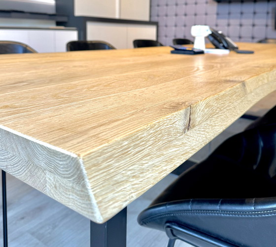 Image 1 of Dining table with oak tree trunk top on metal U-leg