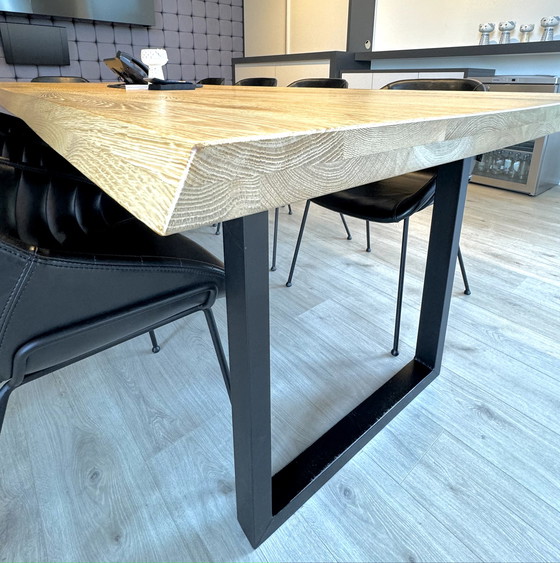 Image 1 of Dining table with oak tree trunk top on metal U-leg