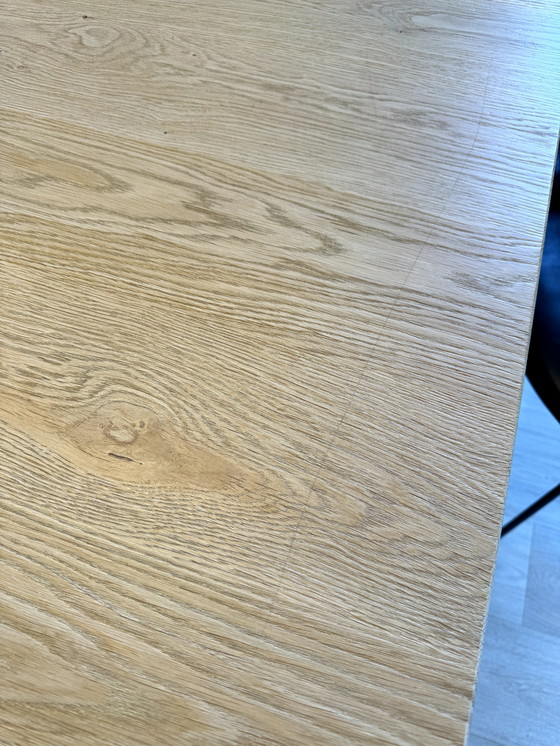 Image 1 of Dining table with oak tree trunk top on metal U-leg