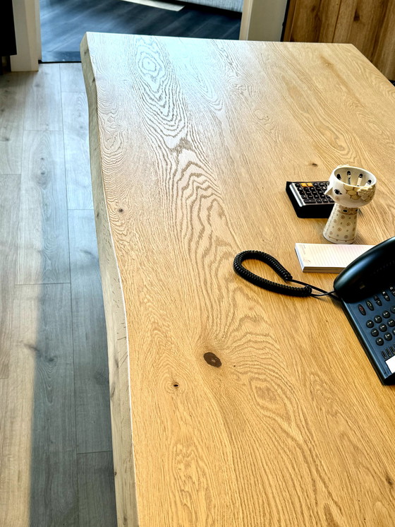 Image 1 of Dining table with oak tree trunk top on metal U-leg