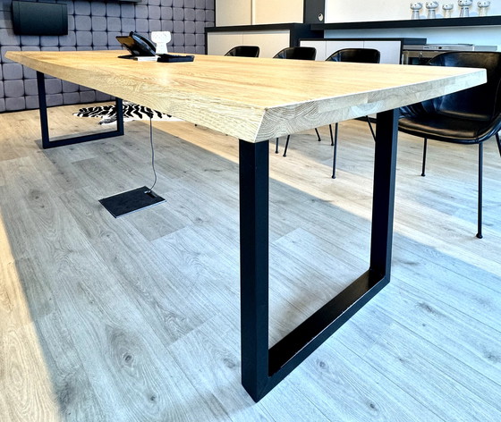 Image 1 of Dining table with oak tree trunk top on metal U-leg