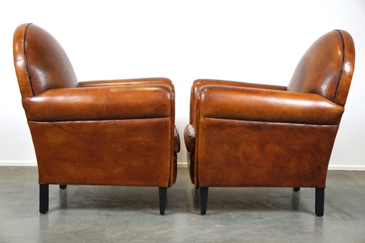 Set of two sheep leather Art Deco style designer armchairs