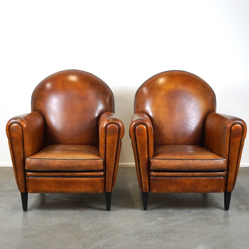 Set of two sheep leather Art Deco style designer armchairs