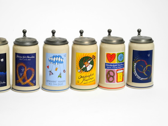 Image 1 of Nine unused original Munich Oktoberfest beer Pitchers with heavy tin lids from 2001 - 2009