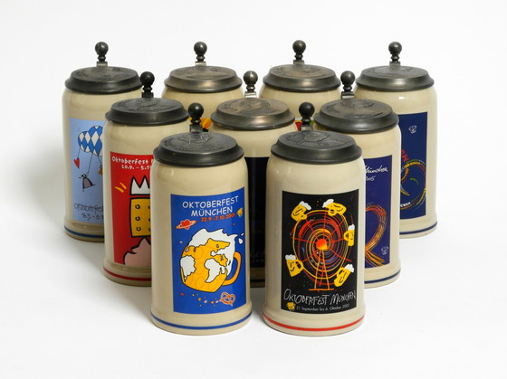 Image 1 of Nine unused original Munich Oktoberfest beer Pitchers with heavy tin lids from 2001 - 2009