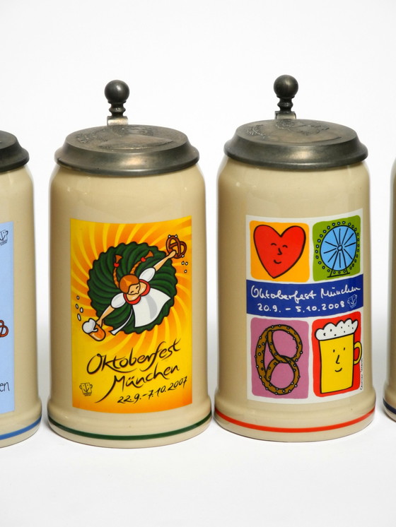 Image 1 of Nine unused original Munich Oktoberfest beer Pitchers with heavy tin lids from 2001 - 2009