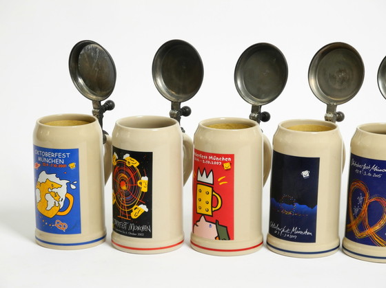 Image 1 of Nine unused original Munich Oktoberfest beer Pitchers with heavy tin lids from 2001 - 2009