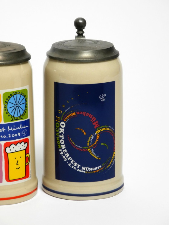 Image 1 of Nine unused original Munich Oktoberfest beer Pitchers with heavy tin lids from 2001 - 2009