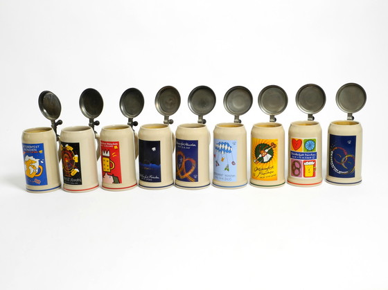 Image 1 of Nine unused original Munich Oktoberfest beer Pitchers with heavy tin lids from 2001 - 2009