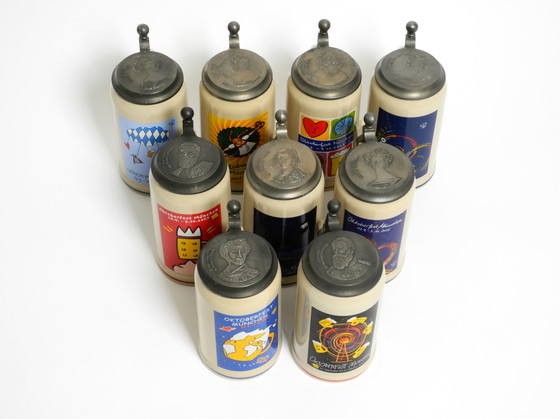 Image 1 of Nine unused original Munich Oktoberfest beer Pitchers with heavy tin lids from 2001 - 2009