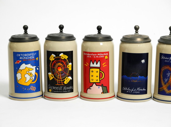 Image 1 of Nine unused original Munich Oktoberfest beer Pitchers with heavy tin lids from 2001 - 2009