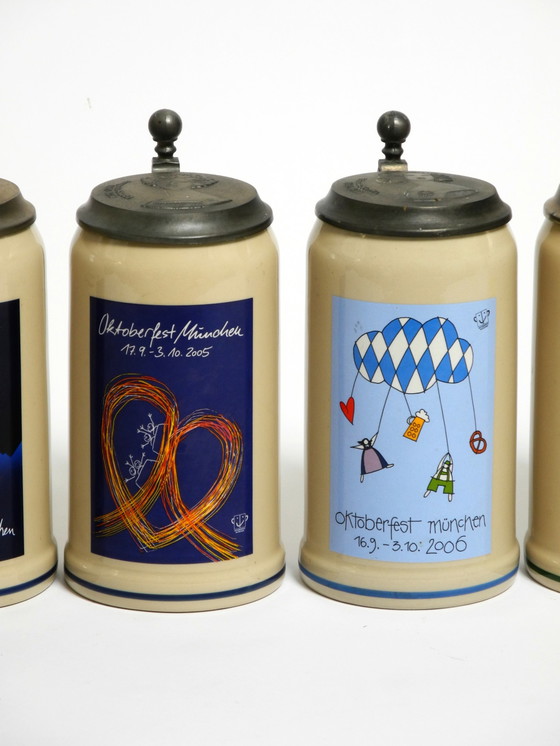 Image 1 of Nine unused original Munich Oktoberfest beer Pitchers with heavy tin lids from 2001 - 2009