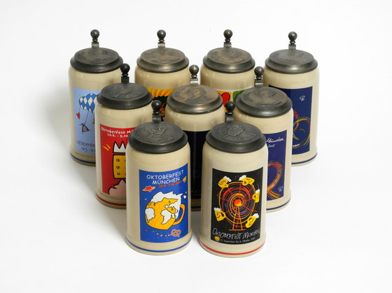 Image 1 of Nine unused original Munich Oktoberfest beer Pitchers with heavy tin lids from 2001 - 2009