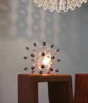 "spare" table lamp made up of 26 light bulbs