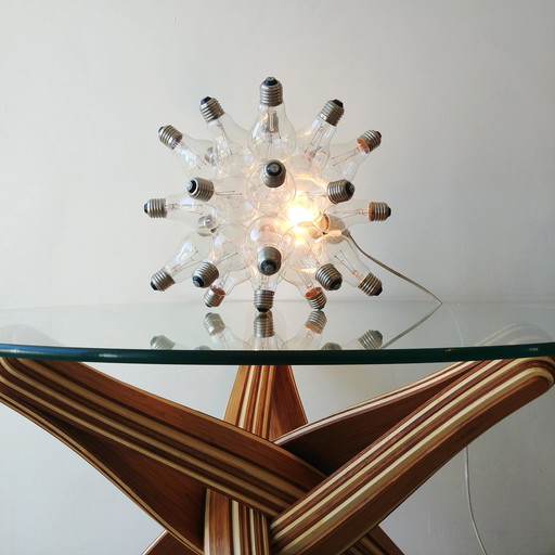 "spare" table lamp made up of 26 light bulbs