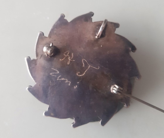 Image 1 of Spilla e pendente a forma di ruota solare con punto Zuni