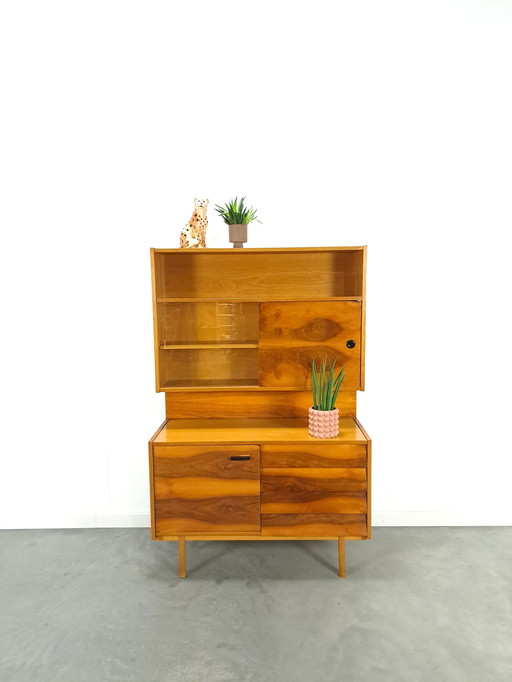 Walnut veneer display cabinet with drawers and mirror wall