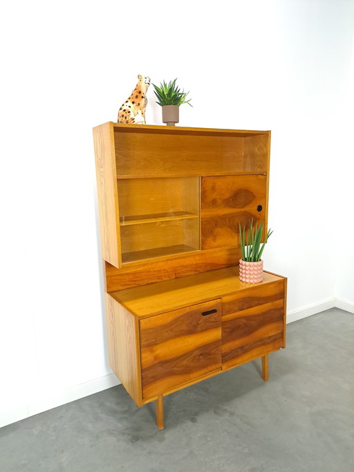 Walnut veneer display cabinet with drawers and mirror wall