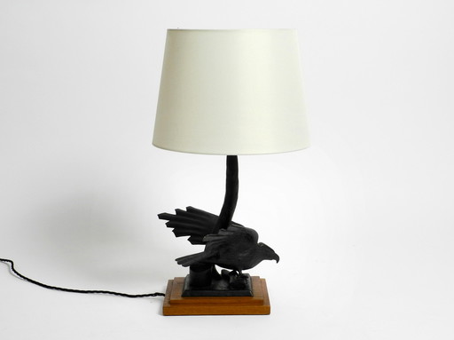 Large 1940s table lamp made of iron in the shape of an eagle with a teak wooden base