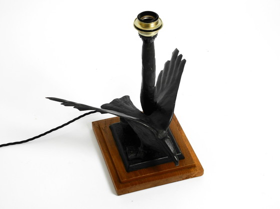 Image 1 of Large 1940s table lamp made of iron in the shape of an eagle with a teak wooden base