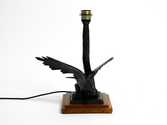 Image 1 of Large 1940s table lamp made of iron in the shape of an eagle with a teak wooden base