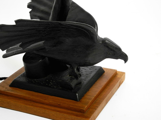 Image 1 of Large 1940s table lamp made of iron in the shape of an eagle with a teak wooden base