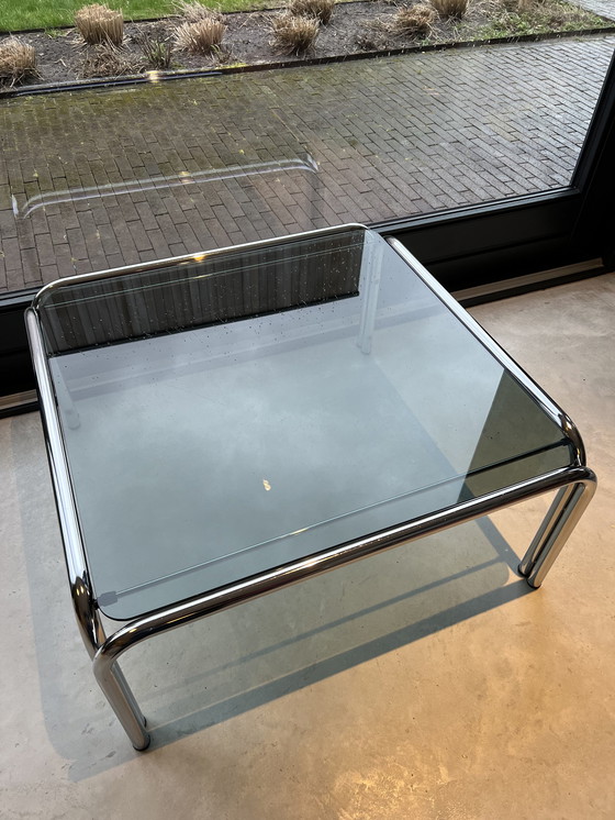 Image 1 of Table basse tubulaire chromée avec plateau en verre fumé