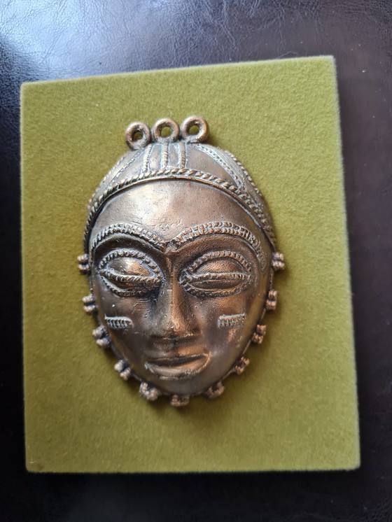 Image 1 of 2x African female and male faces in bronze on wood support