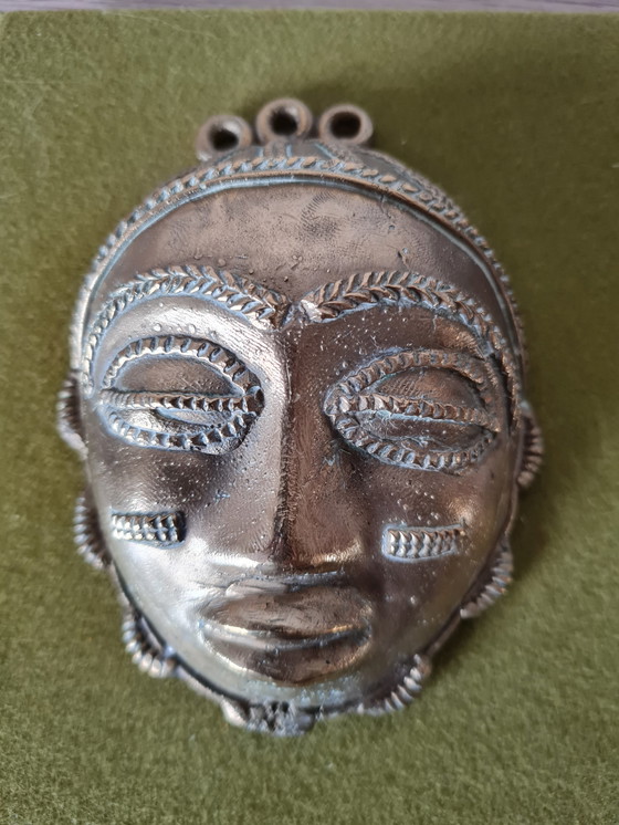 Image 1 of 2x African female and male faces in bronze on wood support