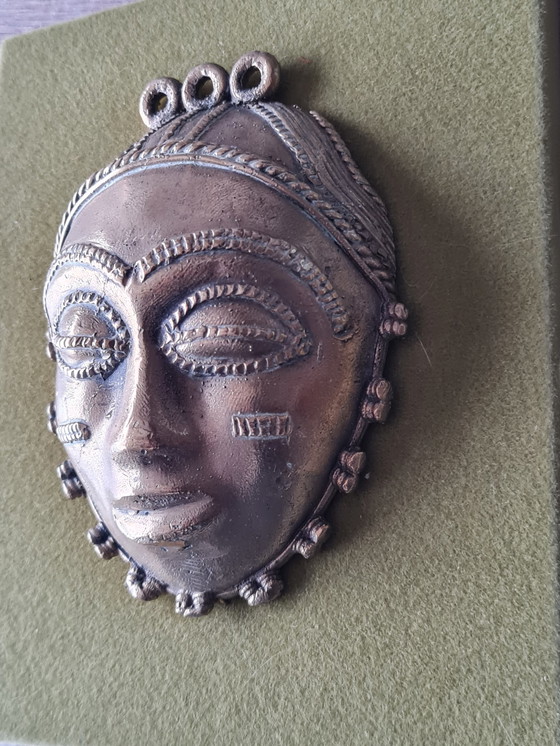 Image 1 of 2x African female and male faces in bronze on wood support