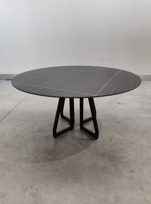 Round dining table with ceramic tabletop