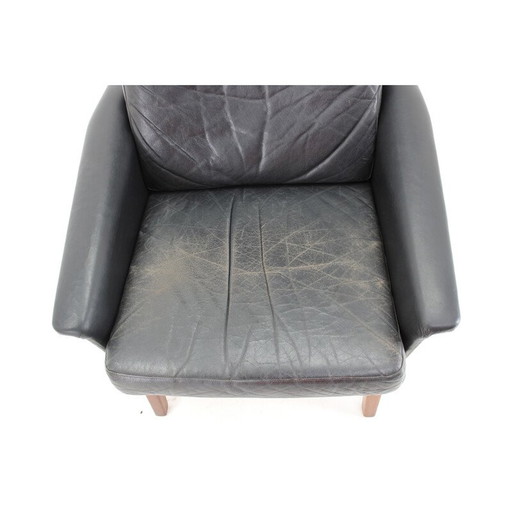 Vintage high-back armchair in leather and teak, Denmark 1970