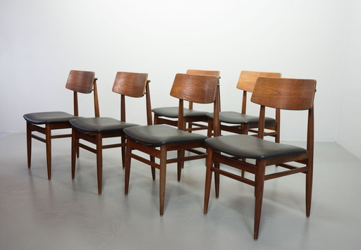 Danish solid teak dining room chairs with Black artificial leather seat. Set of 6. Denmark, 1960s.