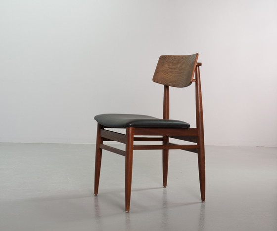 Image 1 of Danish solid teak dining room chairs with Black artificial leather seat. Set of 6. Denmark, 1960s.