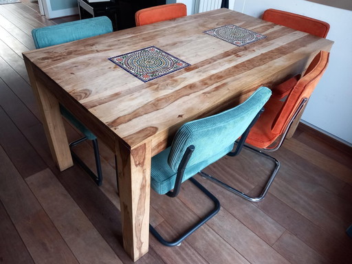 Dining table with mosaic elements