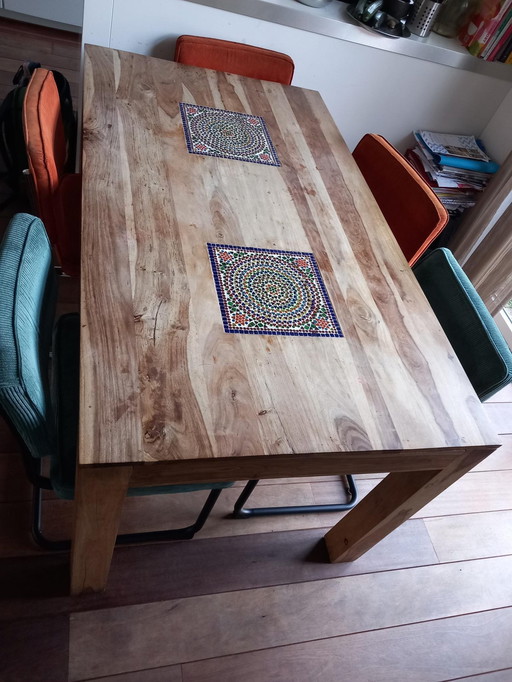 Dining table with mosaic elements