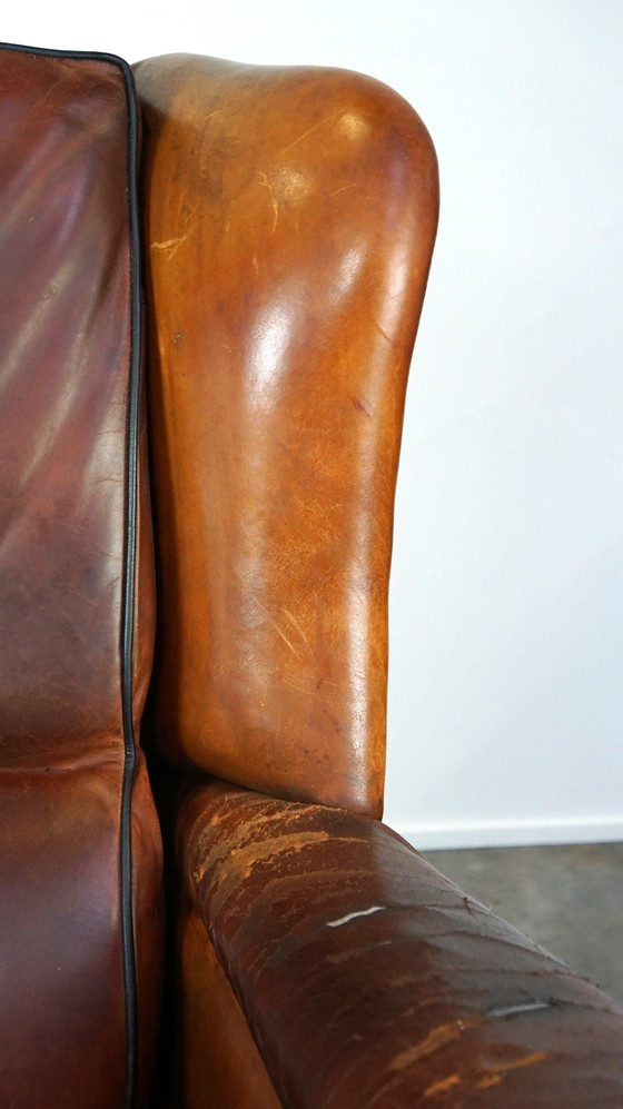 Image 1 of Grand fauteuil à oreilles en cuir de mouton