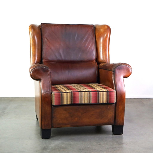 Grand fauteuil à oreilles en cuir de mouton