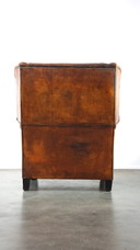 Grand fauteuil à oreilles en cuir de mouton