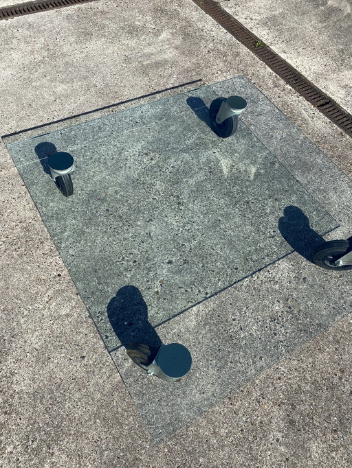 Glass coffee table on wheels