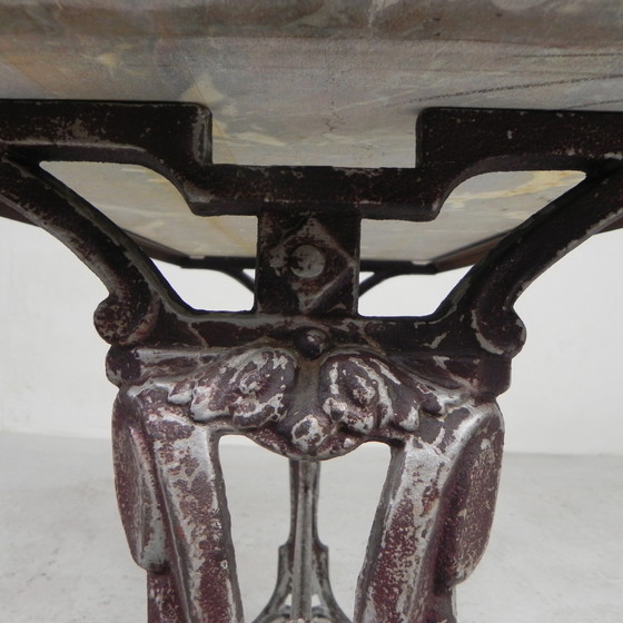 Image 1 of Bistro table, garden table with marble top and rare cast iron frame