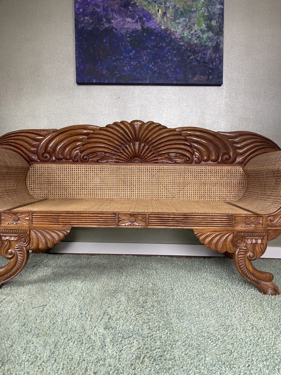 Image 1 of Javanese teak bench with carvings and webbing