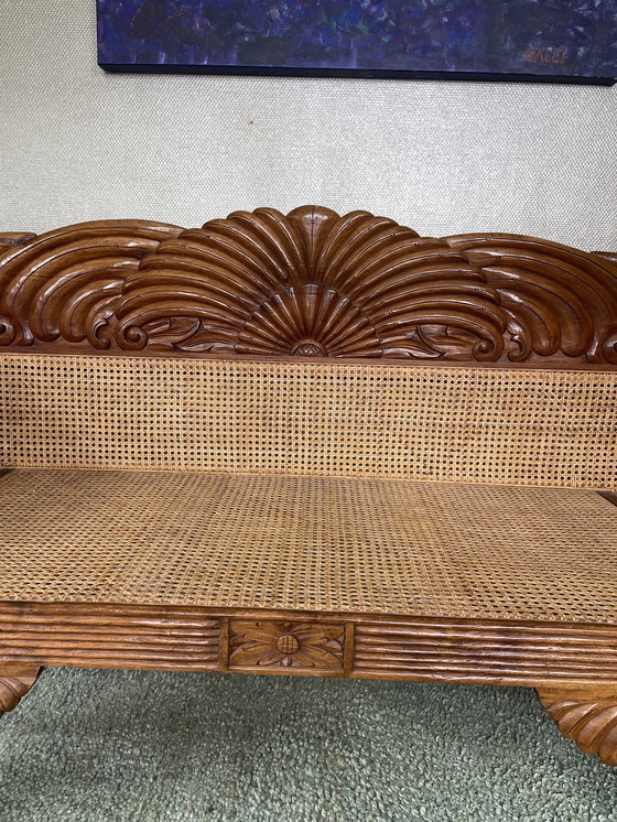 Image 1 of Javanese teak bench with carvings and webbing