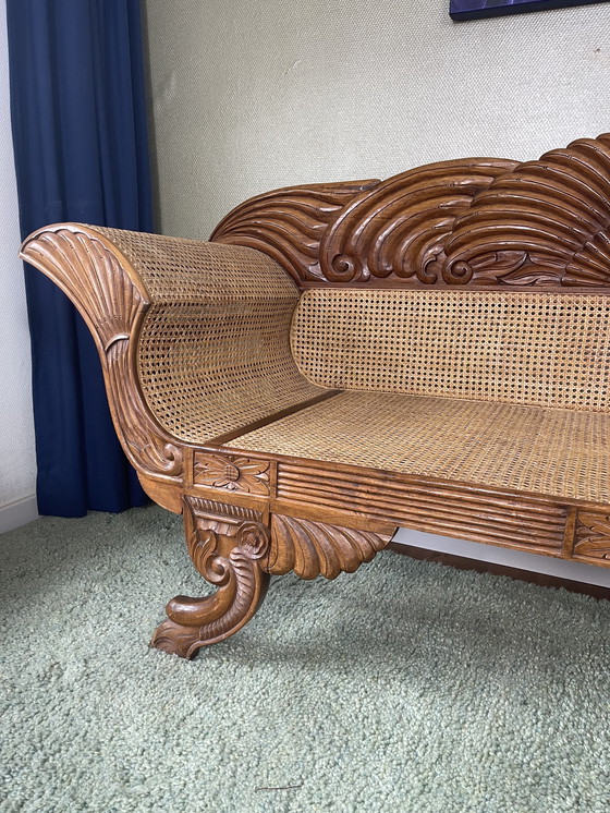 Image 1 of Javanese teak bench with carvings and webbing