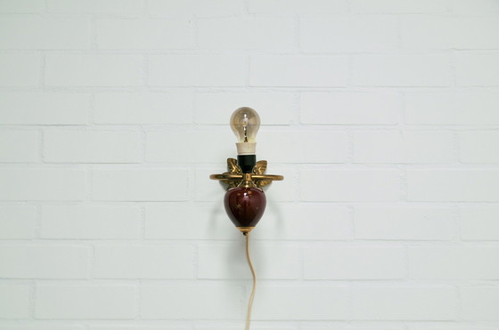 Image 1 of gold & red wall lamp