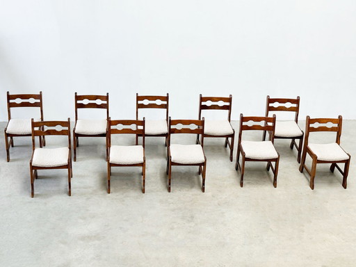 Set of ten brutalist razorback and bouclé dining chairs