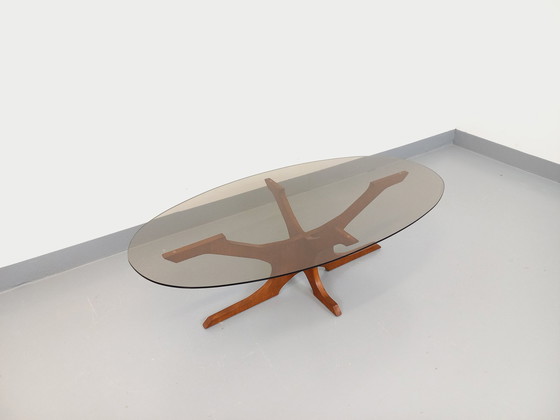 Image 1 of Hugues Poignant Vintage Oval Coffee Table in Teak and Smoked Glass from the 60s and 70s
